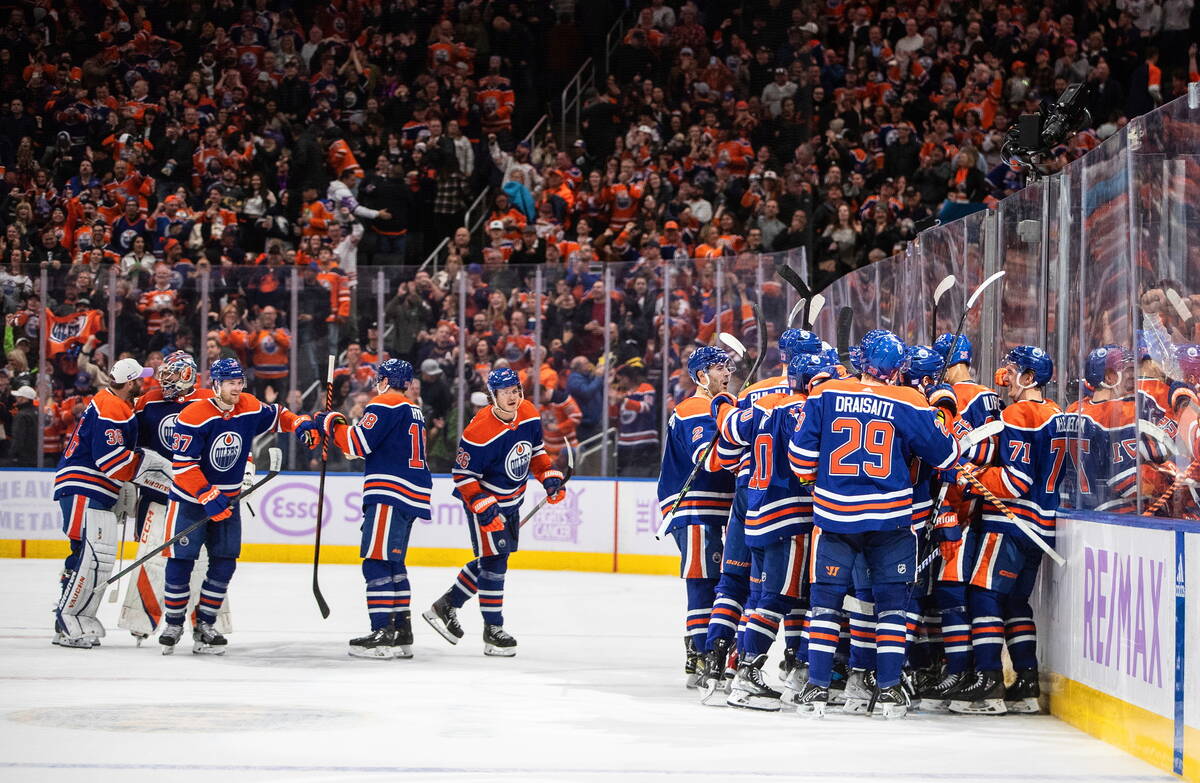 Edmonton Oilers celebrate an overtime win against the Vegas Golden Knights during an NHL hockey ...