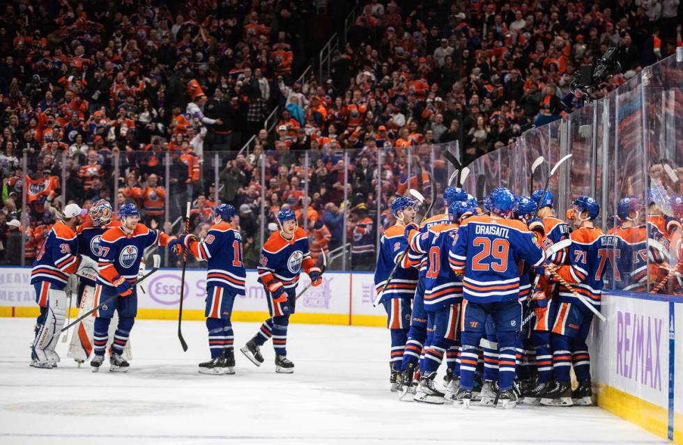 Edmonton Oilers celebrate an overtime win against the Vegas Golden Knights during an NHL hockey ...