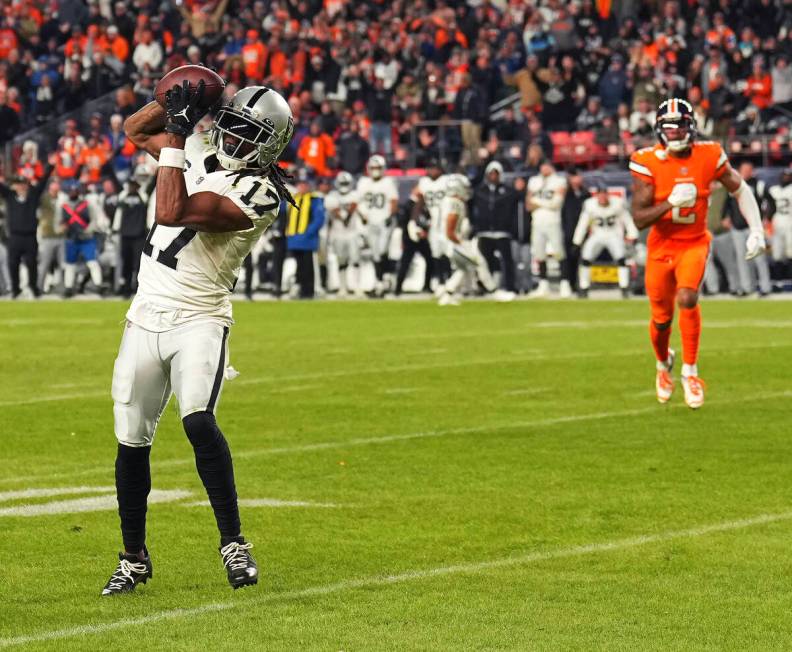 Las Vegas Raiders wide receiver Davante Adams (17) catches a touchdown pass in front of Denver ...