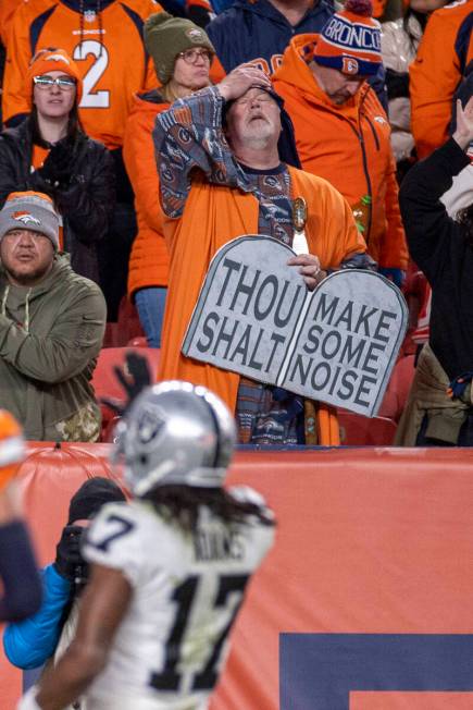 A Denver Broncos fan reacts as Raiders wide receiver Davante Adams (17) scores the game winning ...
