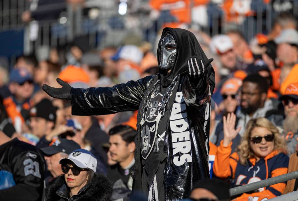 A Raiders fan cheers during the first half of an NFL game against the Denver Broncos at Empower ...