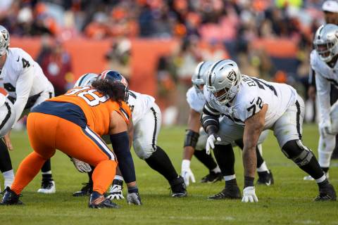 Raiders offensive lineman Jermaine Eluemunor (72) lines up against Denver Broncos defensive tac ...