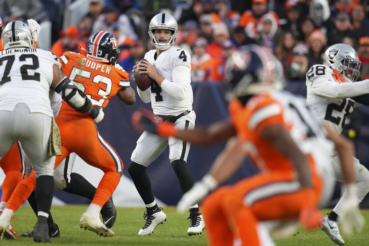Las Vegas Raiders quarterback Derek Carr (4) passes against the Denver Broncos during the secon ...