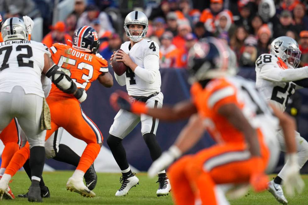 Las Vegas Raiders quarterback Derek Carr (4) passes against the Denver Broncos during the secon ...