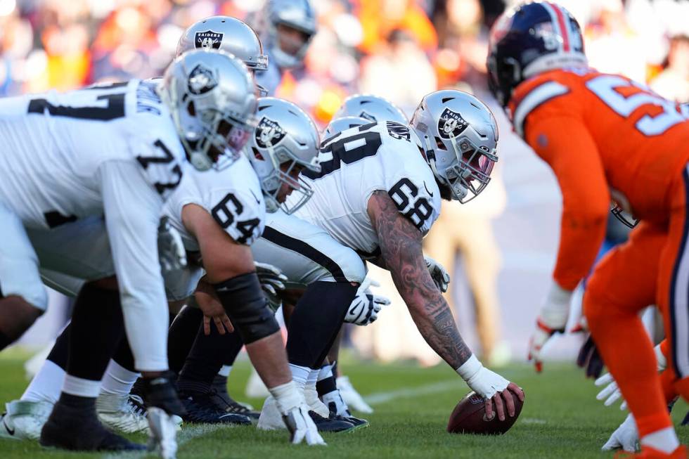 Las Vegas Raiders center Andre James (68) centers the ball at the line of scrimmage during an N ...