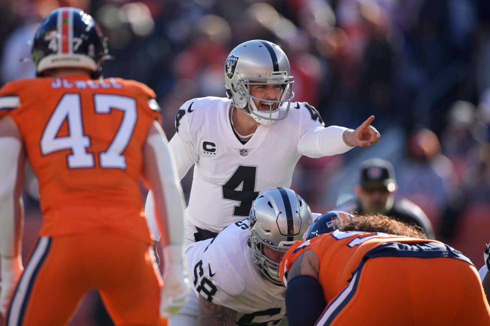 Las Vegas Raiders quarterback Derek Carr (4) signals at the line of scrimmage during the first ...