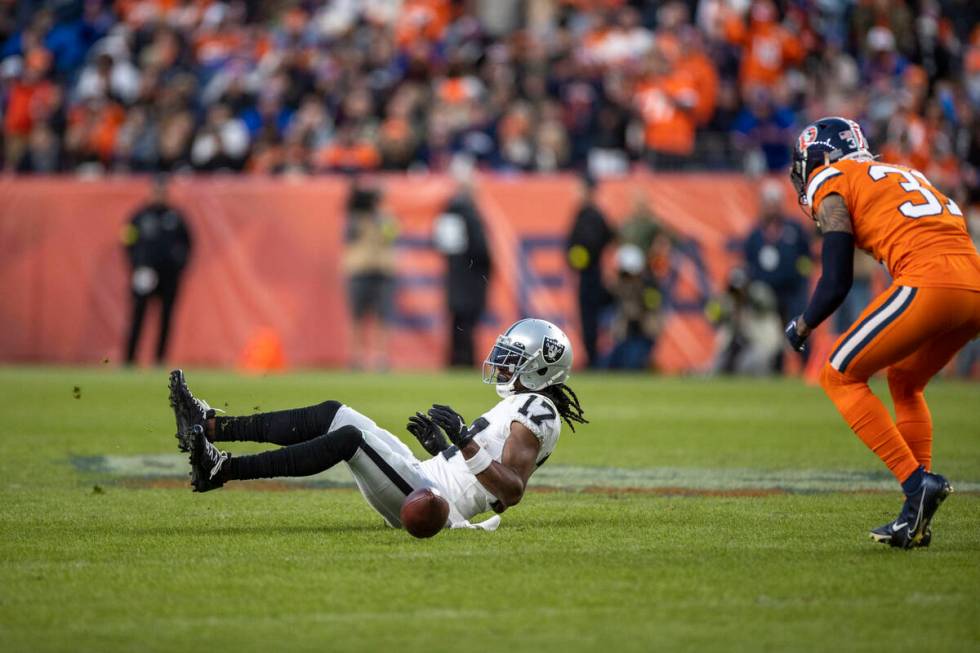 Raiders wide receiver Davante Adams (17) can’t make a catch with Denver Broncos safety J ...