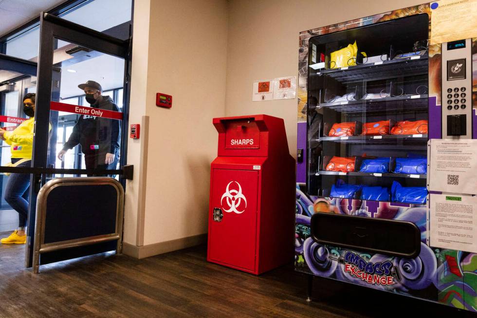 A new public health vending machine and used syringe disposal bin are displayed, as part of an ...