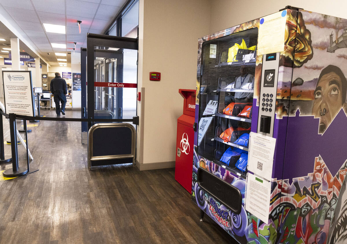 A new public health vending machine and used syringe disposal bin are displayed, as part of an ...