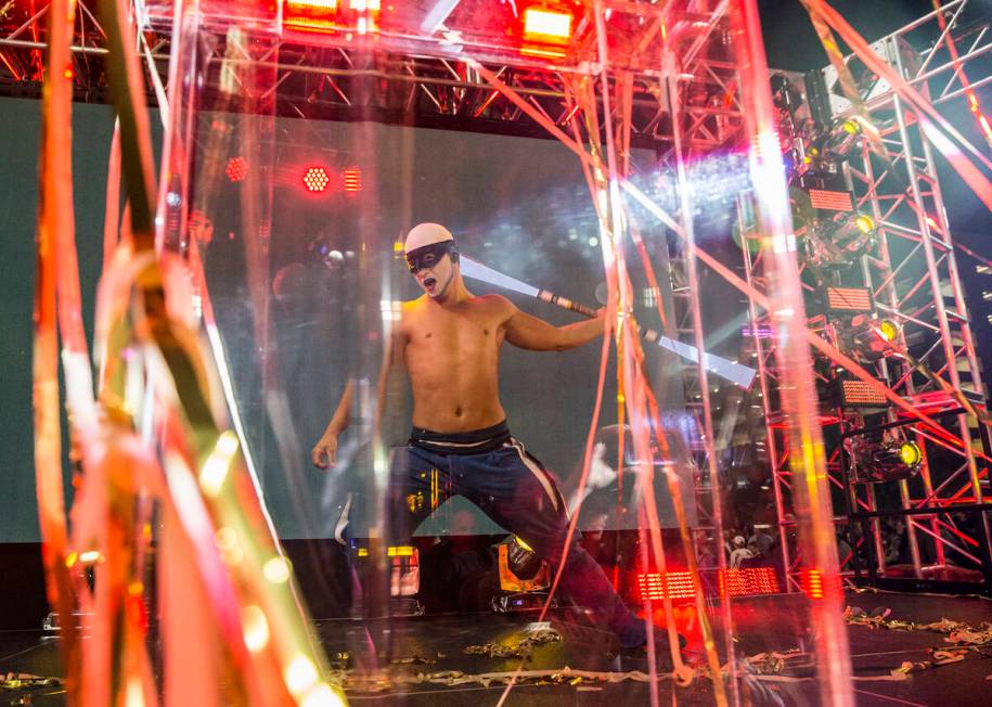 A Cirque du Soleil performer dances during a ceremony to unveil the Las Vegas NHL expansion fra ...