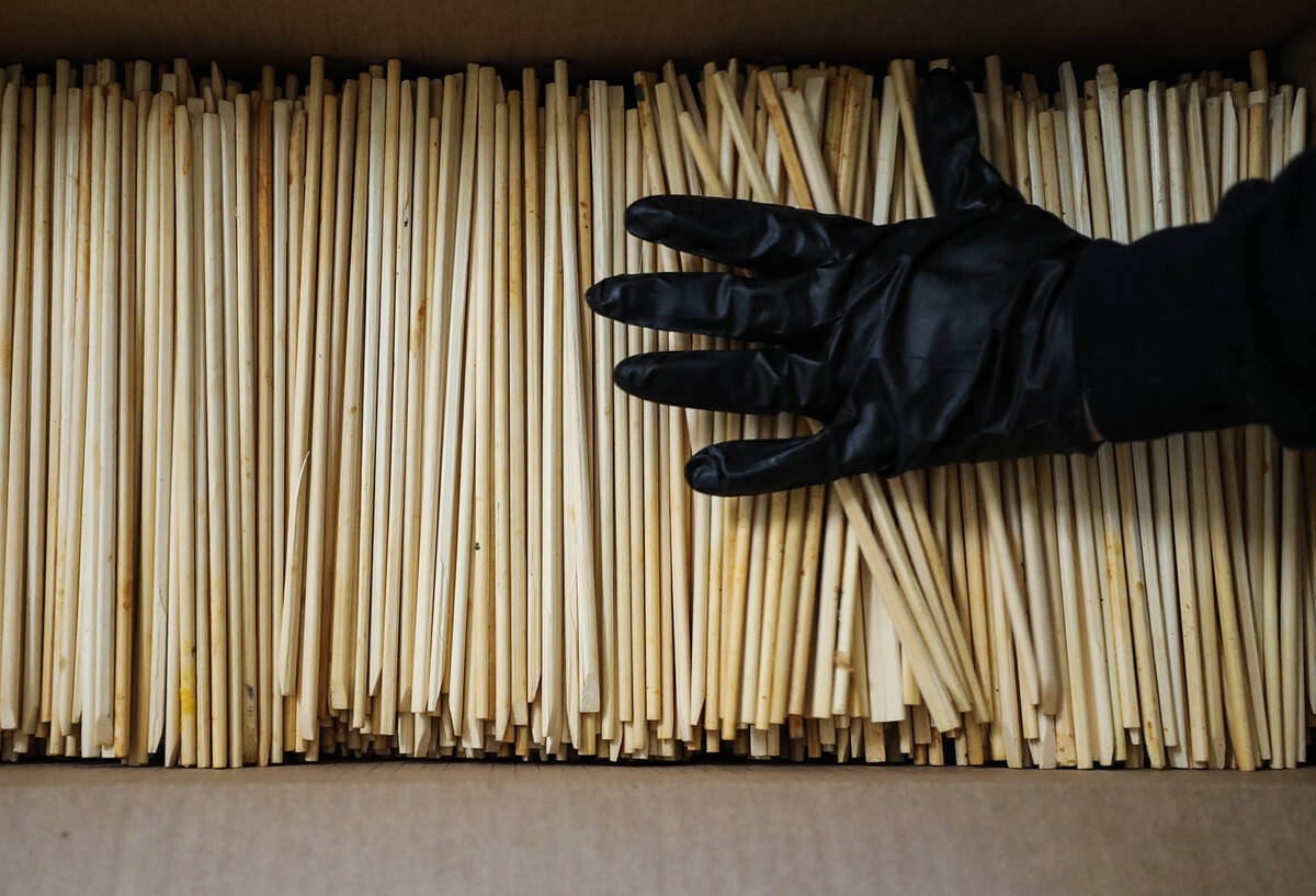 Jorese Lgtiben sorts used chopsticks at ChopValue’s factory in Las Vegas, Tuesday, Nov. 22, 2 ...