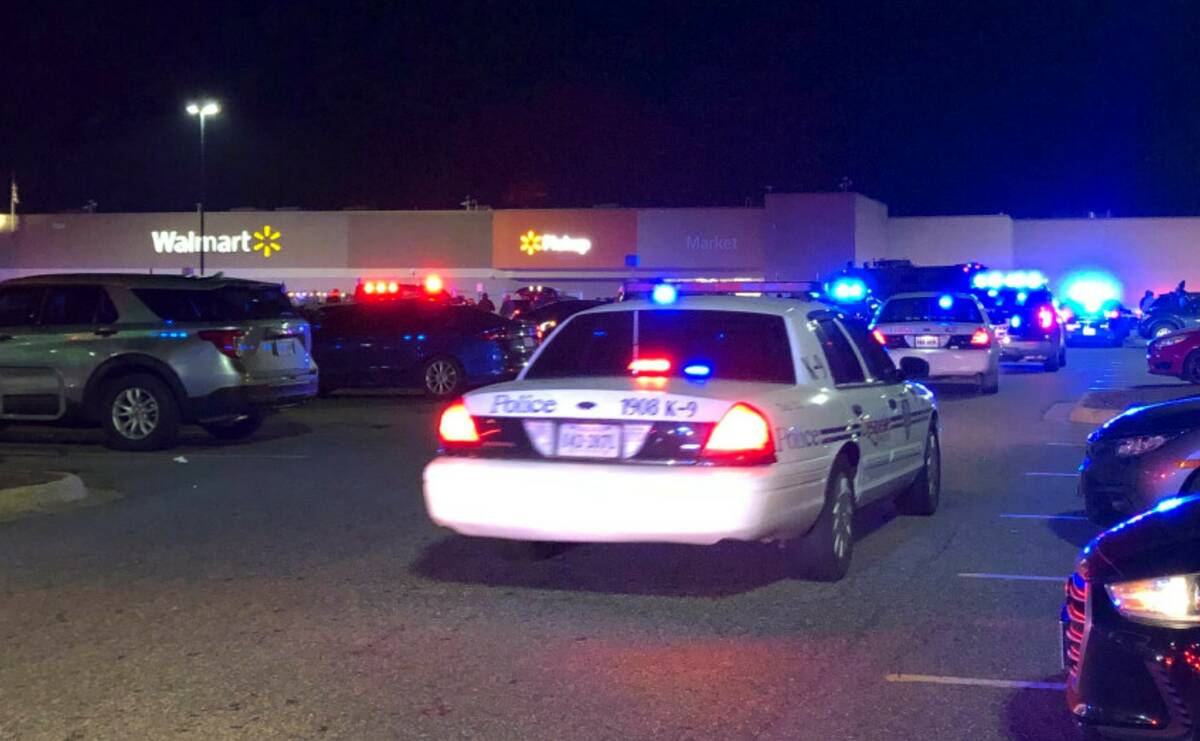 In this image from video, Virginia police respond to the scene of a fatal shooting at a Walmart ...