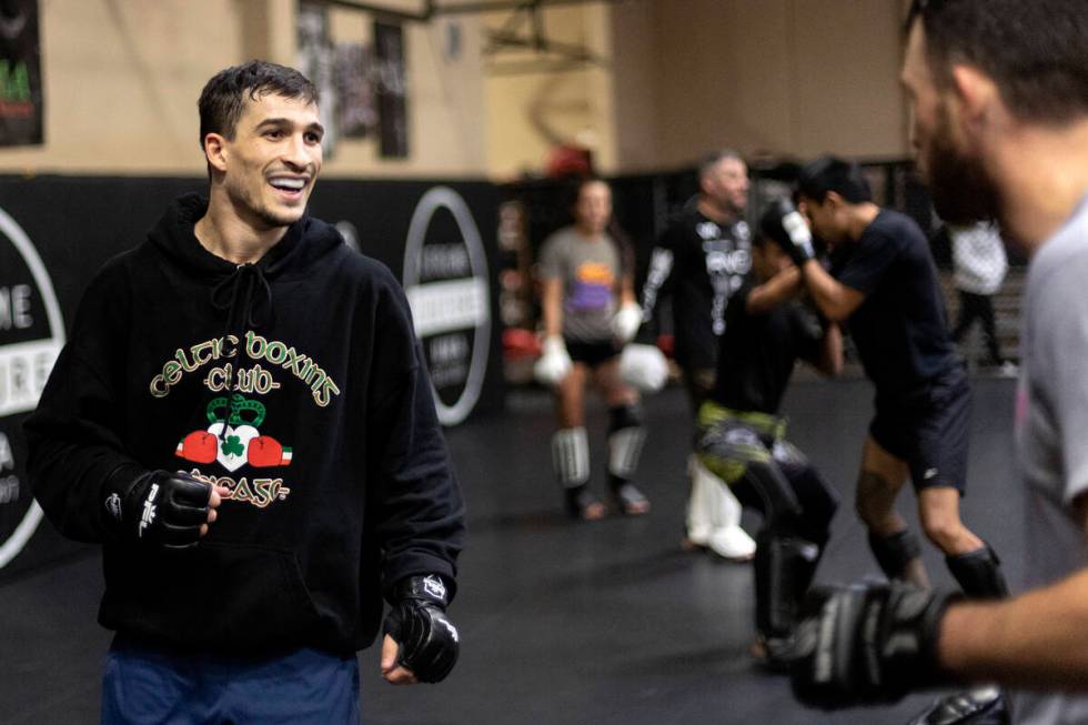 MMA fighter Biaggio Ali Walsh, grandson of legendary boxer Muhammad Ali, laughs while sparring ...