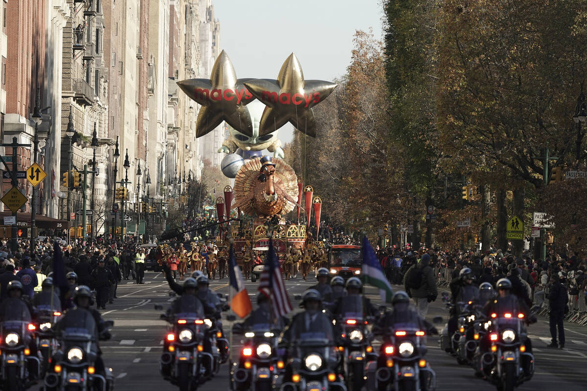 The Tom Turkey float leads the way down Central Park West during the Macy's Thanksgiving Day Pa ...