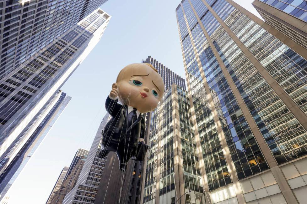 The Boss Baby balloon makes its way down Sixth Avenue during the Macy's Thanksgiving Day Parade ...
