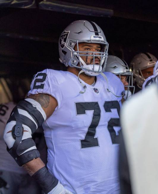 Raiders offensive lineman Jermaine Eluemunor (72) prepares to take the field before an NFL game ...