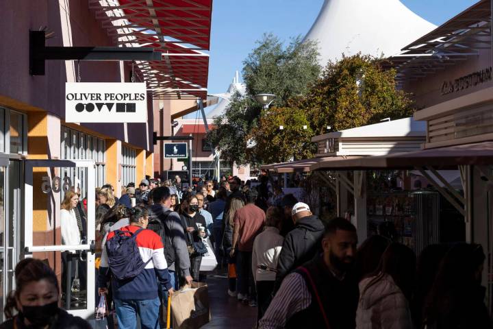 The sun shines on shoppers as they crowd the Las Vegas North Premium Outlets for Black Friday s ...