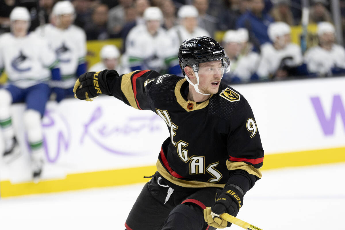 Golden Knights center Jack Eichel (9) pivots direction as the Canucks skate up the ice with the ...