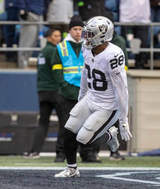 Raiders running back Josh Jacobs (28) scores a touchdown during the first half of an NFL game a ...