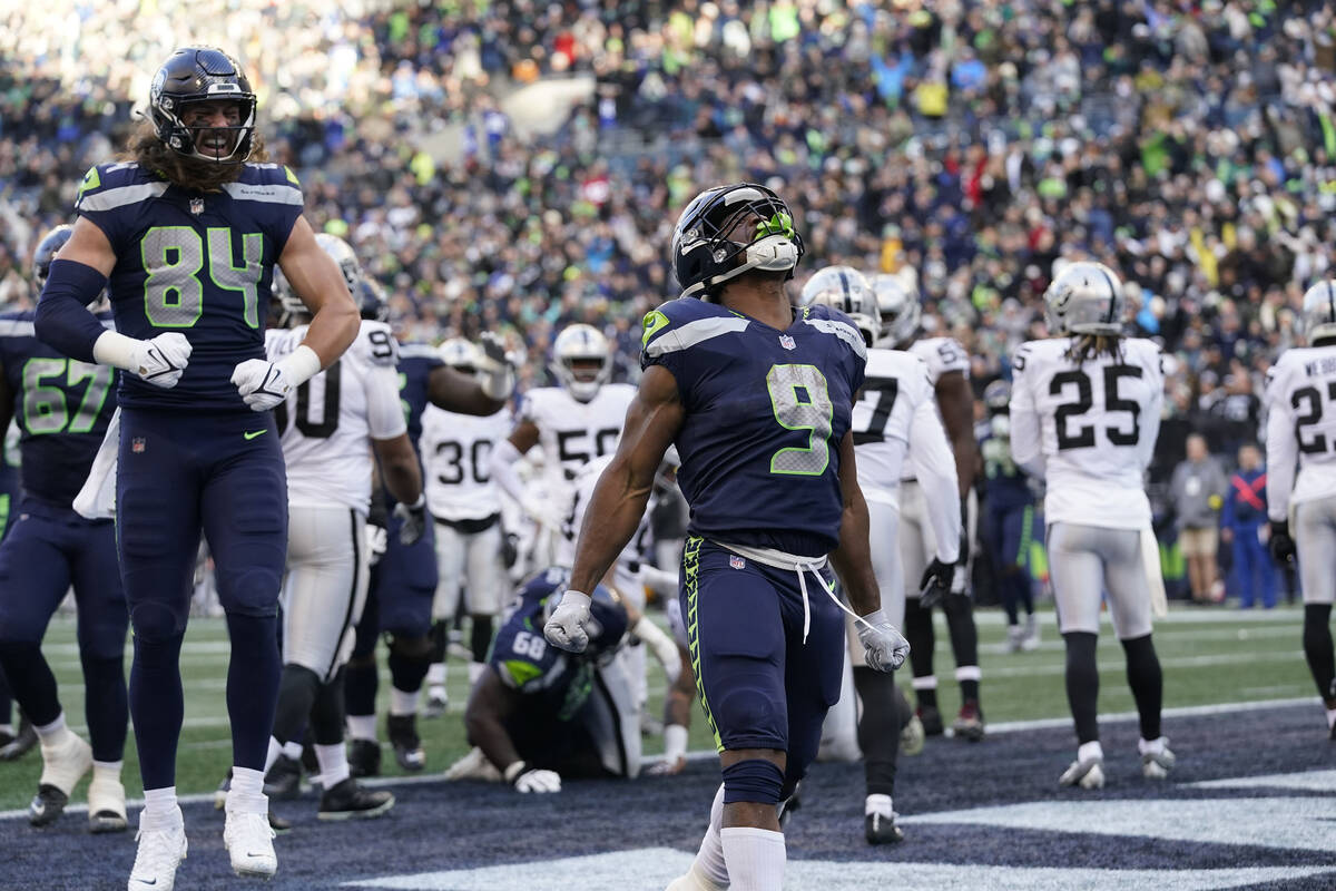 Seattle Seahawks running back Kenneth Walker III (9) celebrates his rushing touchdown against t ...
