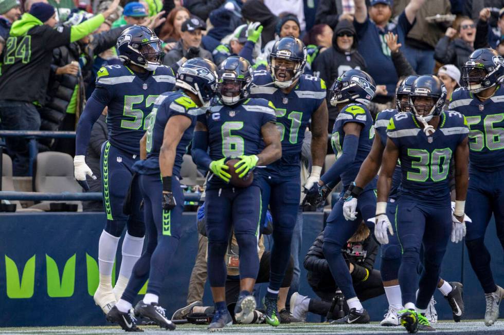 Seattle Seahawks safety Quandre Diggs (6) celebrates his interception with teammates during the ...