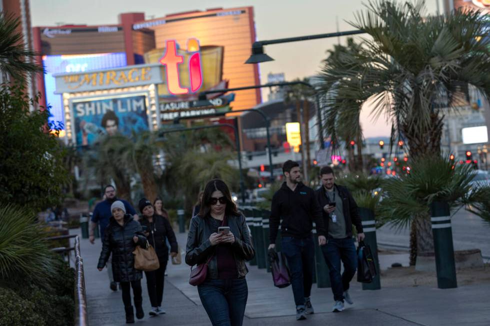 Pedestrians move along Las Vegas Boulevard on the Strip, Tuesday, Nov. 29, 2022, in Las Vegas. ...
