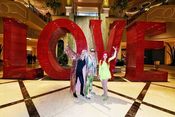 The B-52's Fred Schneider, Cindy Wilson, and Kate Pierson show the love at The Venetian, where ...