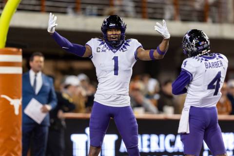 TCU wide receiver Quentin Johnston (1) celebrates a touchdown against Texas with wide receiver ...