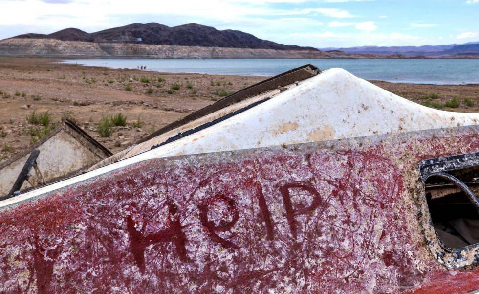 A message on another abandoned boat resting up above the waterline where a body was found at Sw ...