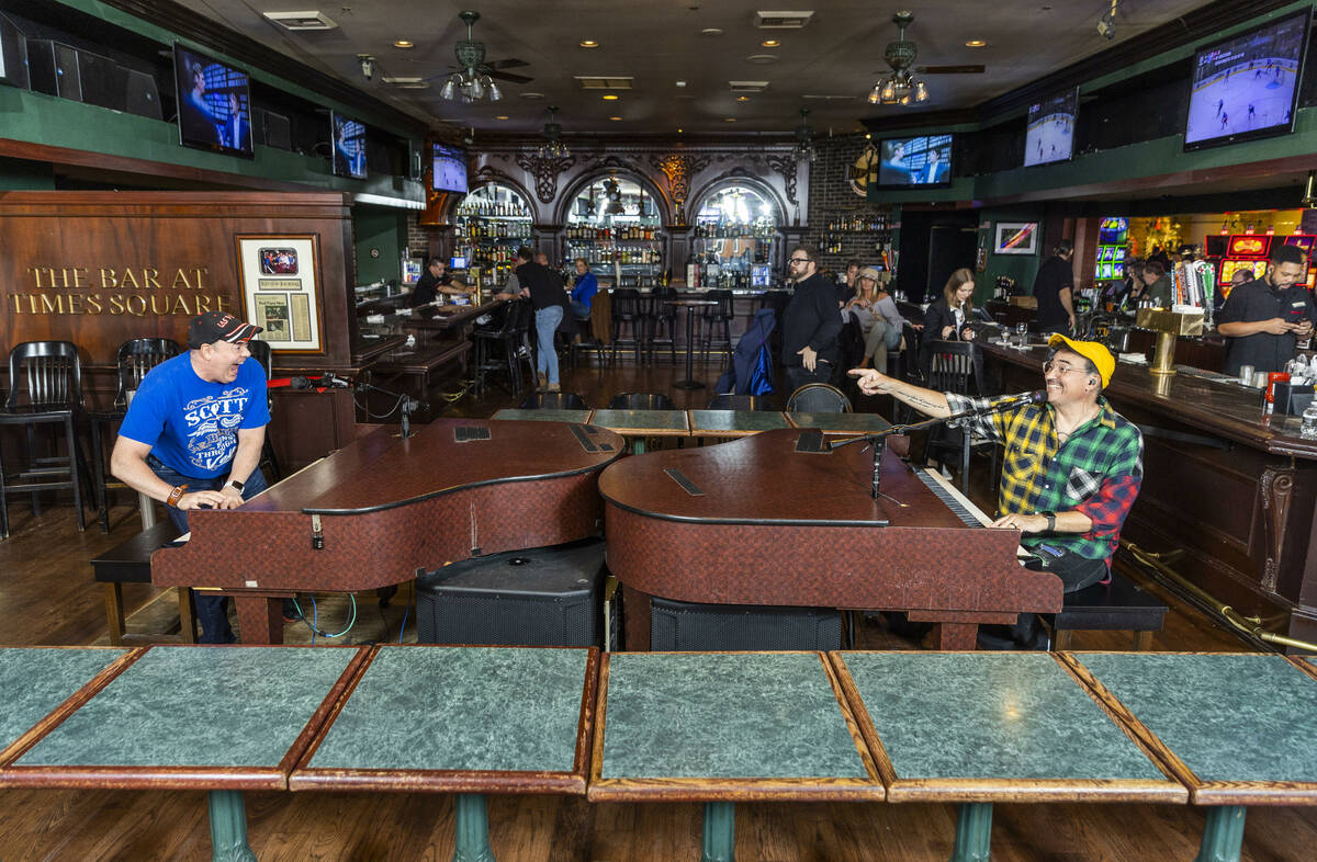 Dueling piano players Scott Ellis, left, and Shaun DeGraff entertain crowds in the Bar at Times ...