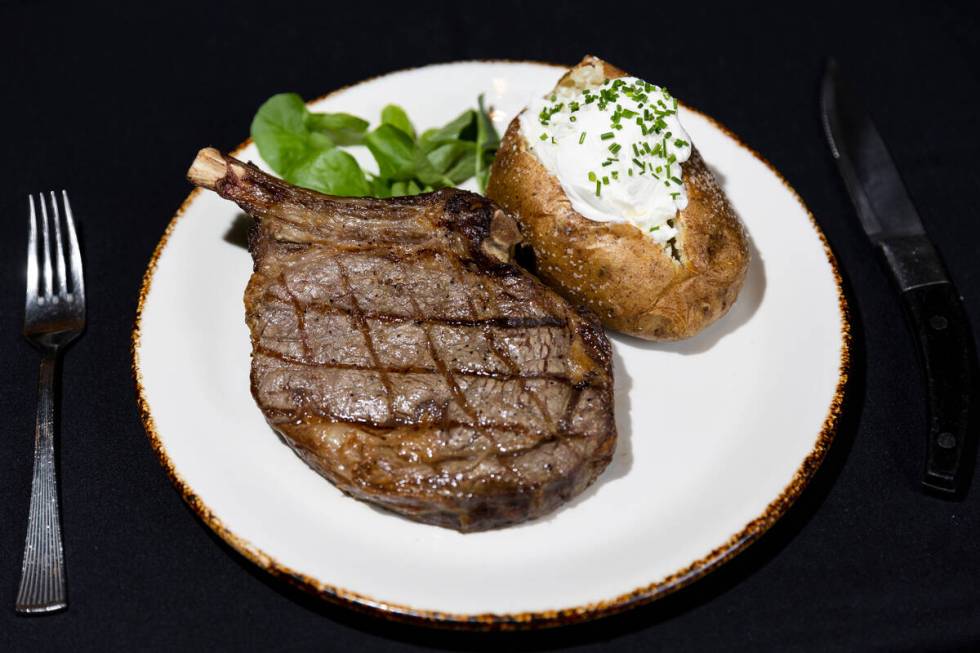 A 16-ounce bone-in ribeye is seen served at Silverado Steak House, at South Point hotel-casino ...