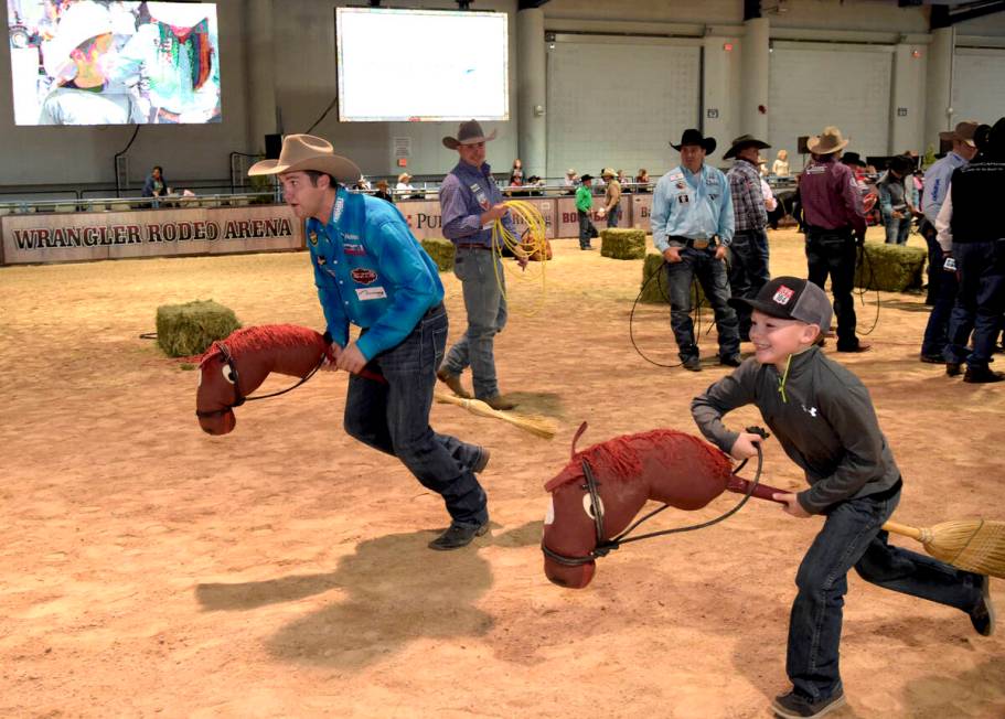 Champion Steer Wrestler Tyler Waguespack takes on challengers as special needs children experie ...