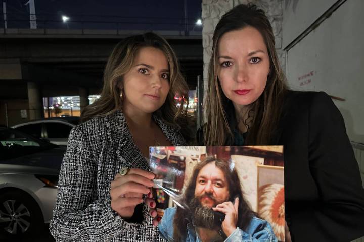 Jerica Barrier of Las Vegas, left, and Jennifer Barrier of Arizona hold a photo of their father ...