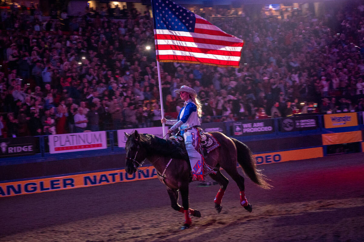 The American flag rides into the Thomas & Mack Center for the nightly rendition of the national ...