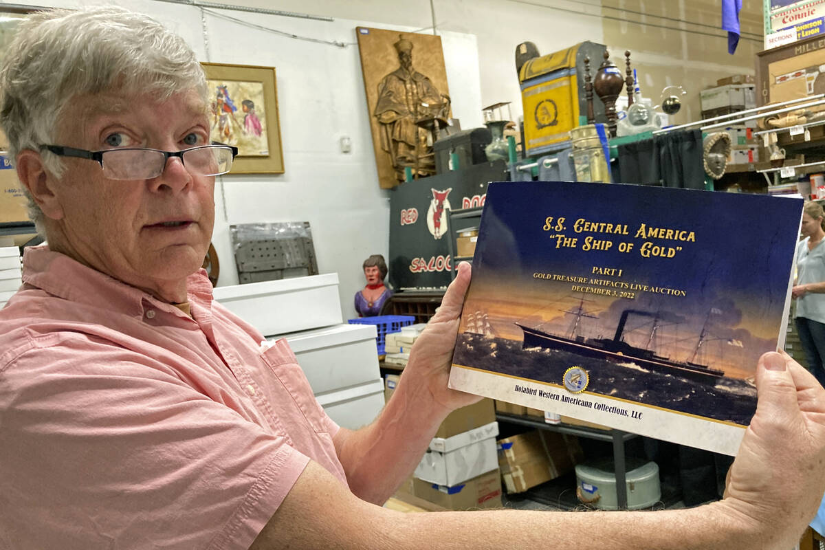 Fred Holabird, president of Holabird Western Americana Collections, poses with a catalog of Gol ...