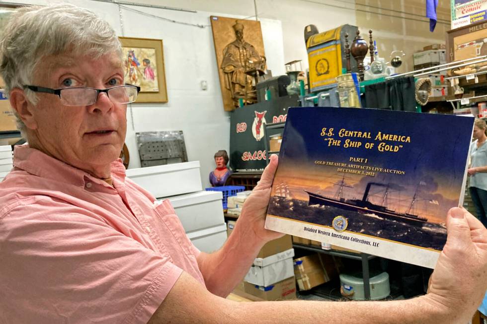Fred Holabird, president of Holabird Western Americana Collections, poses with a catalog of Gol ...