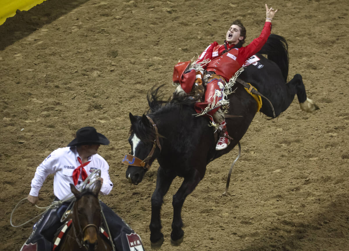 Rocker Steiner, of Weatherford, Texas, reacts at the completion in bareback riding during the f ...