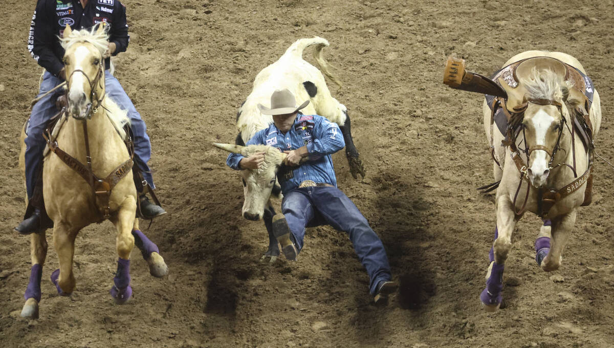 competes during the first night of the National Finals Rodeo at the Thomas & Mack Center on ...