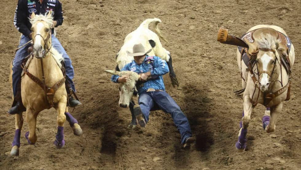 competes during the first night of the National Finals Rodeo at the Thomas & Mack Center on ...