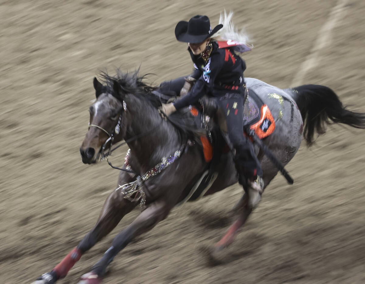 Bayleigh Choate, of Fort Worth, Texas, competes in barrel racing during the first night of the ...
