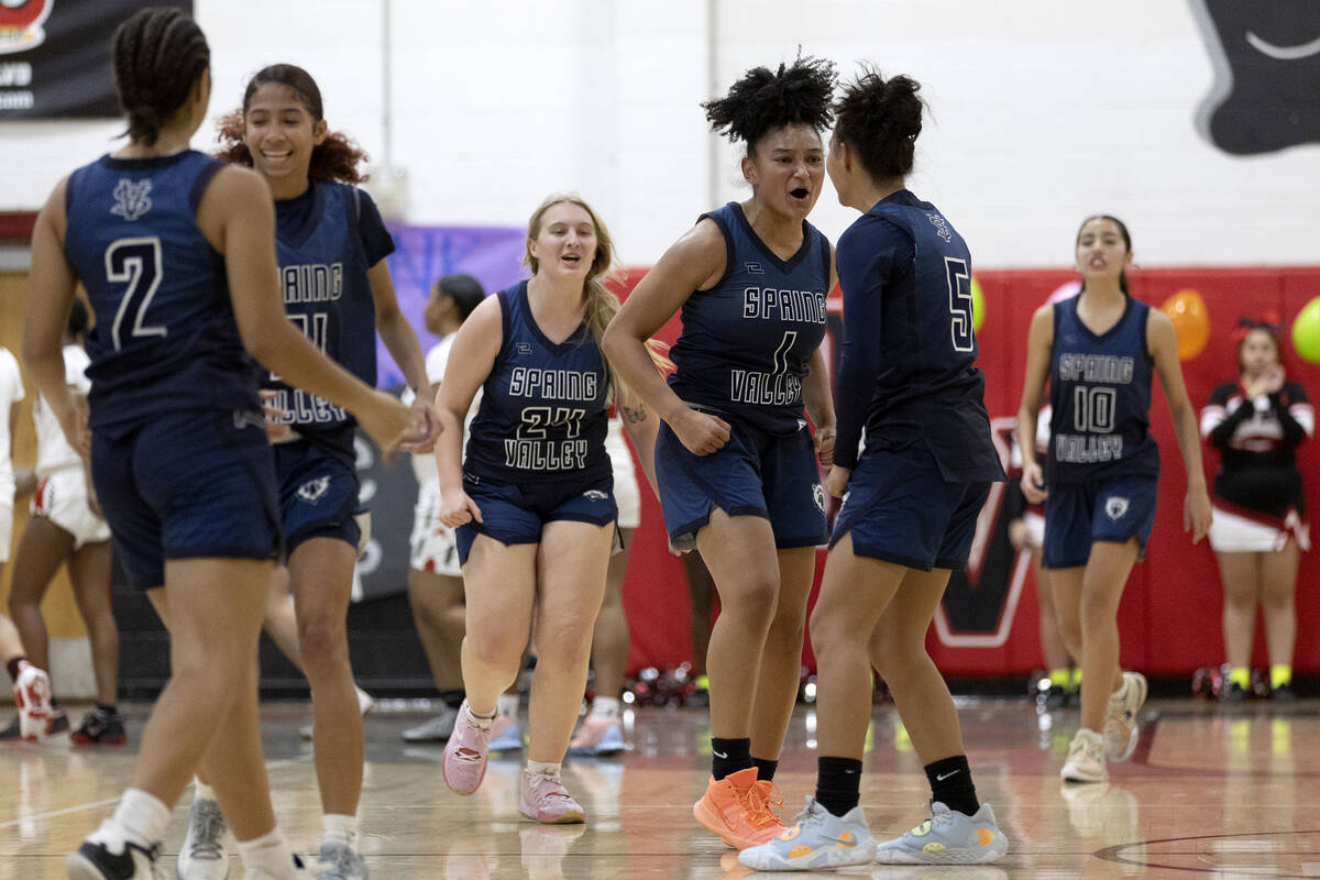 Spring Valley celebrates after their Mia Ervin (1) hit a three-pointer at the halftime buzzer d ...