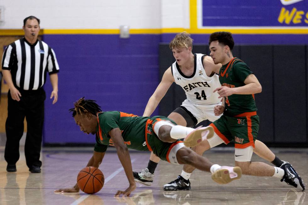 Mojave’s Jameer McNeal (5) dives for the ball while Faith Lutheran’s Layton Barr ...