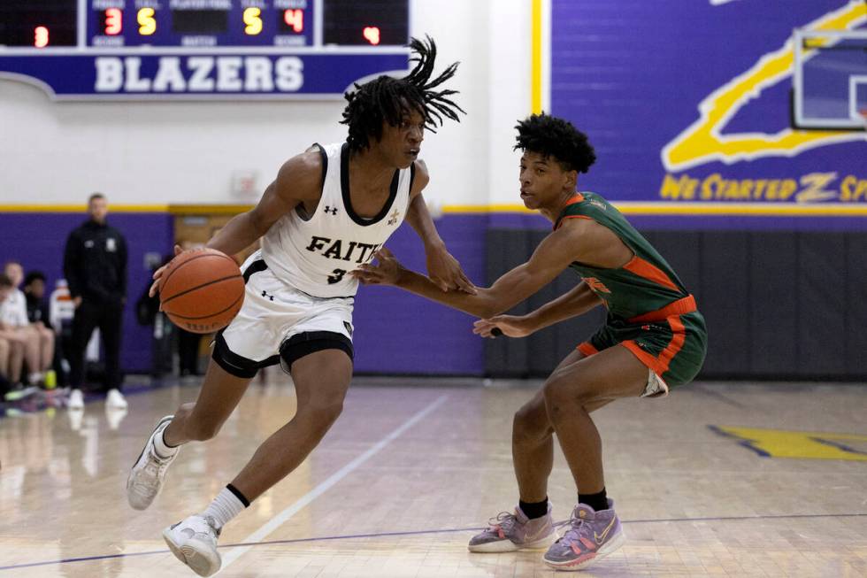 Faith Lutheran’s JohnPaul Agu (3) drives around Mojave’s Zaccarion Jackson, right ...