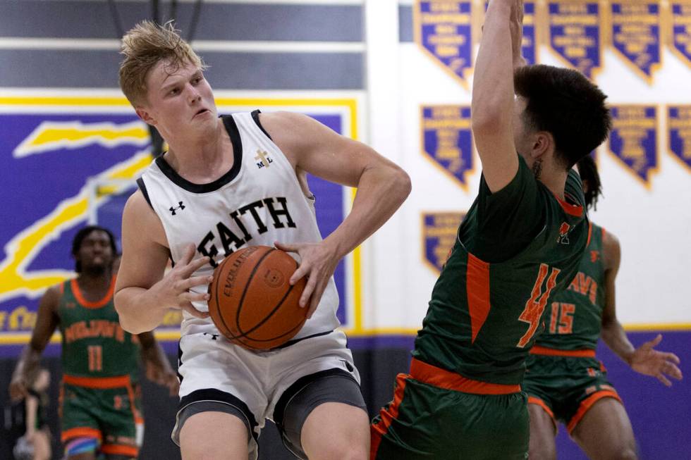 Faith Lutheran’s Layton Barr drives around Mojave’s Casen Lochridge (4) during a ...