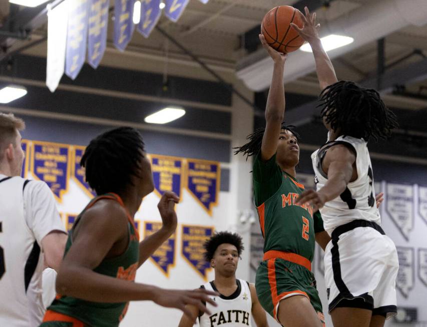 Mojave’s Giali Chapman (2) shoots against Faith Lutheran’s JohnPaul Agu during a ...