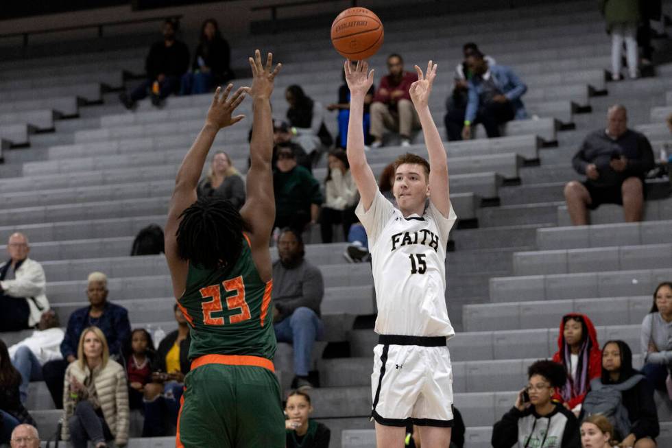 Faith Lutheran’s Graydon Lemke (15) shoots against Mojave’s Donte Hookfin (23) du ...