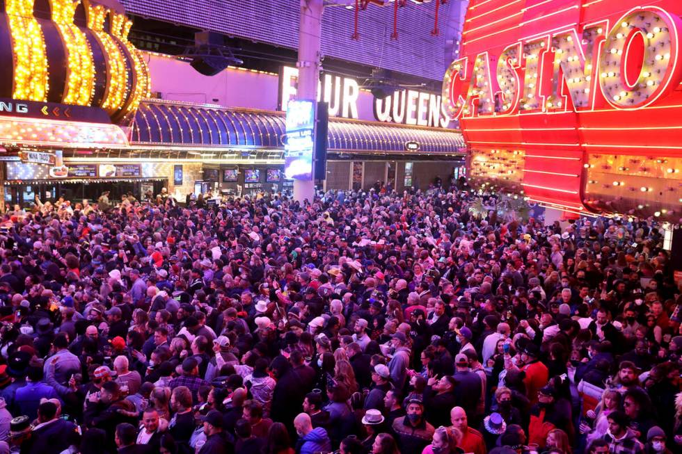 FILE - Revelers celebrate on New Year's Eve at the Fremont Street Experience in downtown Las Ve ...