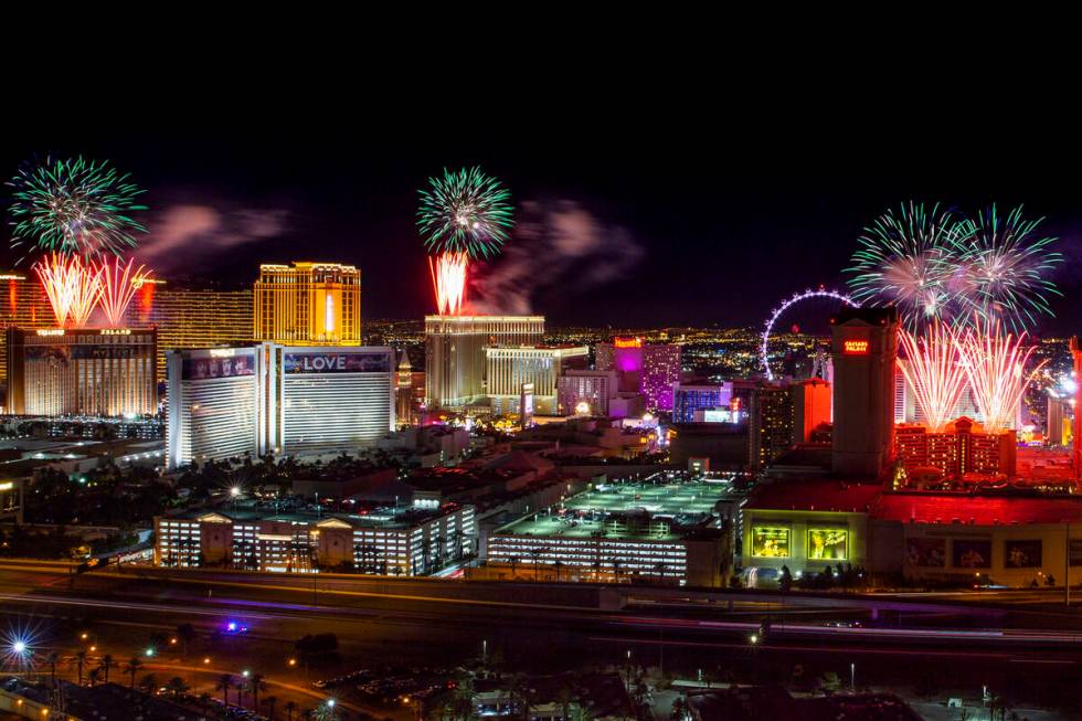 Fireworks for New Year's Eve erupt over the Strip as viewed from the VooDoo Rooftop Nightclub & ...