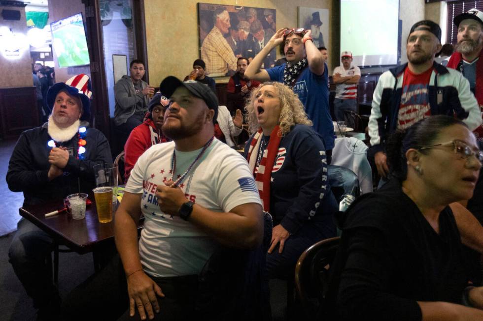 Las Vegans Mike Lillo, left, Rayven Lewis, back left, Victor Velasquez, center left, and Alison ...