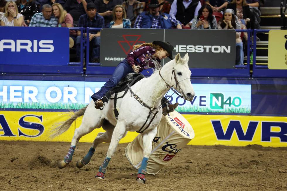 Emily Beisel knocks down a barrel while competing in the barrel racing event in the 64th Wrangl ...